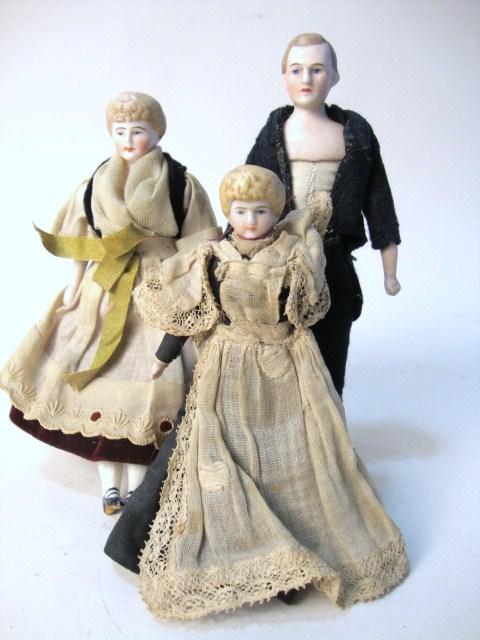 Group of Three Dollhouse Dolls: Group of Three Dollhouse Dolls, 6 1/4" man, 6" lady, & 5" maid, all Parian/bisque heads, arms & legs & cloth bodies, clothing original