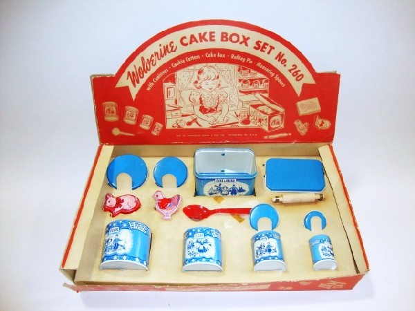 Wolverine Cake Box Set: Wolverine cake box set No. 260, Dutch boy/girl pattern, canister cake box, cookie cutters, etc. Box 17" (l) x 10" (w) x 2 3/4" (h)