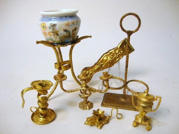Ormolu Accessories: Ormolu and gilt metal dollhouse accessories: plant stand, coffee urn, candlesticks, sugar tongs, bottle holder, 8 pcs, 3" t
