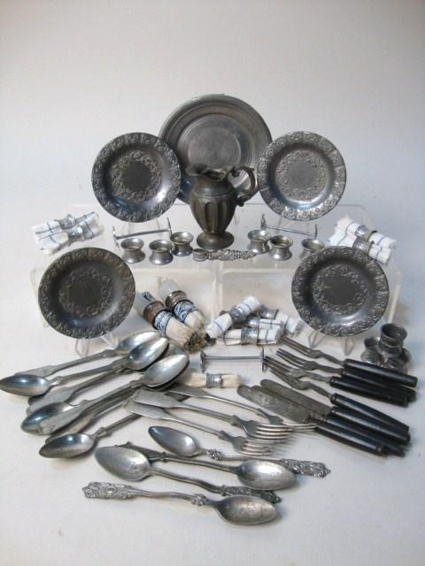 Pewter Napkin Rings, Silverware: Grouping of pewter napkin rings, knife rests, plates, wood handle silverware, miscellaneous pewter silverware