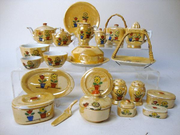 Japanese Utility Set: Japanese utility set with flower pot design, lemon reamer, pancake plate, mixing bowls, canister set, teapot, syrup pitcher, cookie jar platter, etc.
