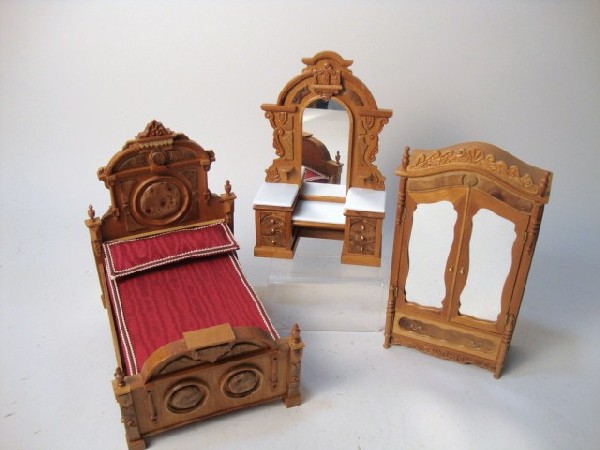 Artisan Victorian Bedroom Set: Elaborately carved Renaissance Revival bedroom suite comprising a bed, dresser and armoire with burled walnut panels, signed J. Gurner.