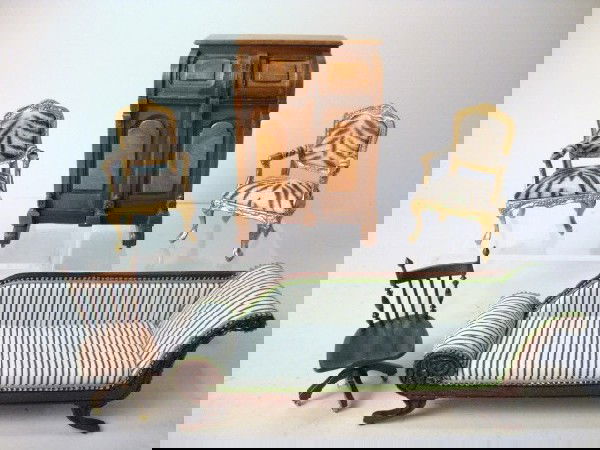 Artisan Wooton Desk and Recamier: A handsomely detailed Wooton desk with swivel chair, Duncan Phyfe style recamier, and pair of gilt armchairs with faux zebra upholstery, all signed J. Gurner.