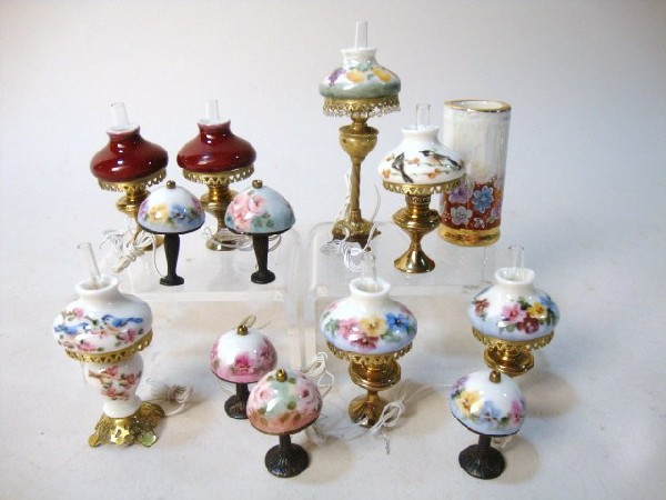 Twelve Ni-Glo Lamps and Umbrella Stand: Twelve Ni-Glo table lamps with hand painted shades, plus a hand-painted umbrella stand. 13 pcs,