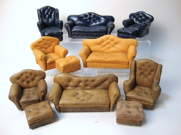 Leather Sofas and Chairs: Large group of overstuffed sofas, chairs and ottomans upholstered in leather and signed by Pat Tyler.
