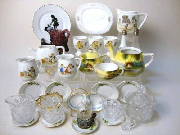 Tea Set/Glassware Pieces: Glassware & teaset, pieces from various sets, cat designs, elephant playing sports, tree in meadow, Pennsylvania sugar creamer, spooner, egg cups, miscellaneous other pieces, 3 1/4" t