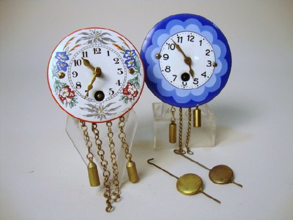 Two Graniteware Clocks: Two round graniteware clocks, both marked Germany, 2 3/4" (d) largest