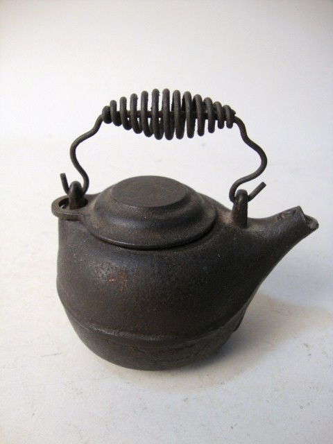 Griswold Miniature Tea Kettle: Griswold miniature tea kettle marked "Use ERIE Ware The Best", 2 1/4" t
