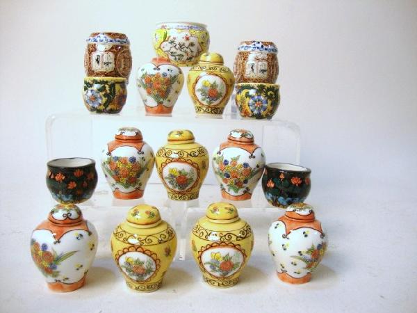 Ceramic Vases: A generous assortment of Oriental style vases, jardinieres and a pair of garden stools, none marked. One lid missing.
