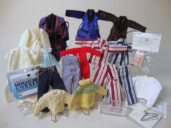 Large Lot of Clothing and Hangers: Generous assortment of miniature pajamas, nightgowns, long-johns, knitted sweaters and hangers.