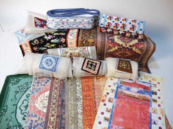 Fine Needlepoint for Rugs and Cushions: A large assortment of needlepoint worked on fine mesh to use for rugs, chair cushions and throw pillows. Over fifty pieces of needlework plus 12 other printed or woven rugs.