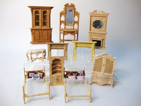 Half-Scale Unfinished Furniture: An assortment of half-inch scale unfinished furniture including a bed, corner cupboards, fireplaces, chests, etc.10 pieces plus some tiny needlepoint pillows