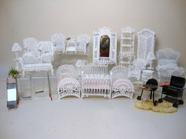 Large Lot of Wire Wicker Furniture: Eighteen pieces of white painted wire wicker furniture, mostly beds and chairs, plus some outdoor grills and a swingset.
