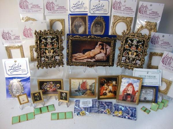 Lot of Picture Frames and Prints: A large lot of framed prints, empty frames, two framed needlepoint embroideries, and a large assortment of small brass tabletop frames.
