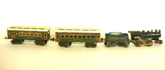 Vintage Ives Train Set Limited Vestibule Express 4: Ives O gauge 4 piece set includes Engine 0-4-0 #1117 cast iron, tin tender Vestibule Express printed on side, 2 coaches, 1 printed #129 Saratoga, 1 #130 Buffet, both coaches are 8 wheels and printed L