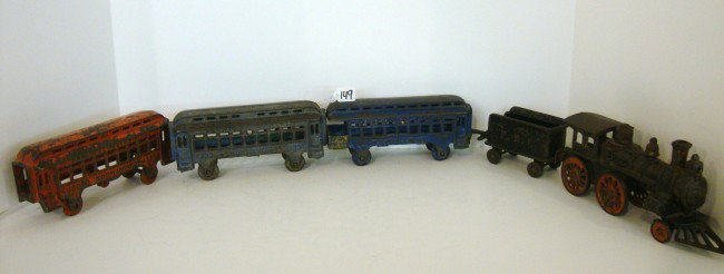 Cast Iron Hubley 5 pc Train Set: Hubley 5 piece train set with General style Cast Iron Engine w/tender marked P.R.R. & 3 passenger cars all marked Normandie, sizes all approximate and in inches L/W/H - engine 8 1/2 x 2 1/2 x 3 1/2, t