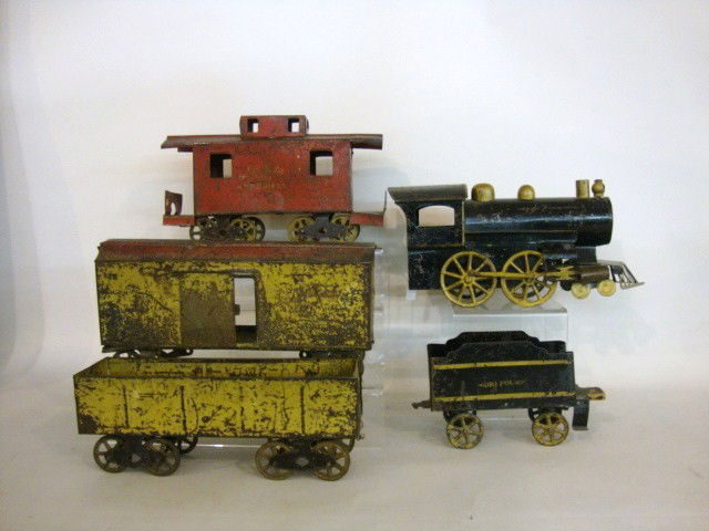 Large Push Tin Locomotive 5 pc Train Set: Four pieces include the Large Locomotive w/Tin Cab, Wood Boiler, lamp, stack & boiler caps, wheels metal 4-4-0 engine alignment, front wheels built into base, all sizes in inches L,,H, 14 x 6 1/2, Ten