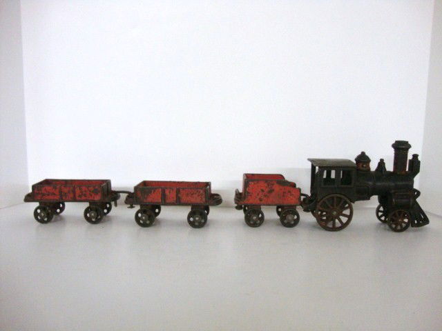 Vintage Antique Carpenter CI 4 pc Freight Train: All Original 4 piece Carpenter Cast Iron Freight Train, Complete set includes engine, tender, & 2 cars, total length is 21 inches, all moving wheels & all couplers, paint very good to excellent, lengt