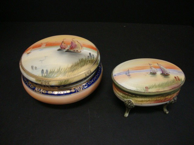 Pair of Noritake Covered Boxes: Round Porcelain Box with hand painted scene of sailboats, nice cobalt & gold trim 5 1/2" (di), - Oval Box with hand painted scene of sailboats set on 4 raised legs 4 1/2"