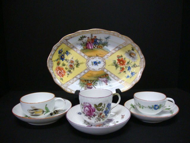 Three Cups & Saucer Set and Serving Dish: Three cups and saucer sets and a serving dish all hand decorated with floral designs, serving dish is decorated w/courting scenes as well as floral motif, 3 pcs. Have Meissen crossed sword mark, one h