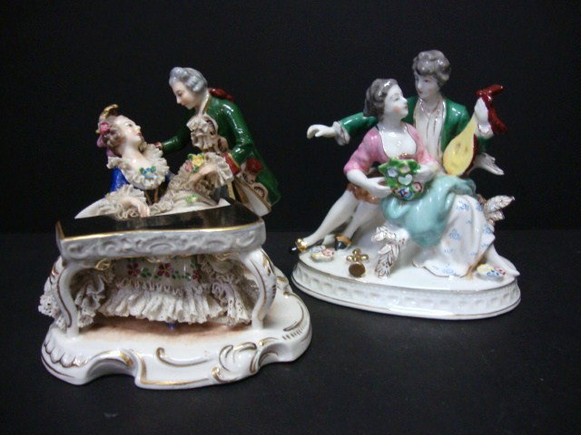 Porcelain Figurines: Porcelain figurines Ornate Volstedt figurine 5 1/4 inches high with a woman playing a harpsichord with a gentlemanleaning over her both dressed in court attire woman has a porcelain lace dress. Second