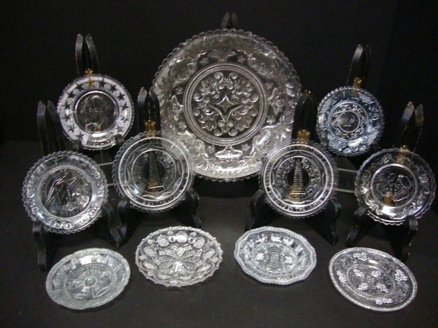 Ten pressed glass butter dishes and a pressed sti: Ten pressed glass butter dishes and a pressed stipple glass serving dish. butter dishes are as follows "the wedding day three weeks after" 3 3/8". "Benjamin Franklin" 3 1/2 ". "Henry Clay" 3 3/8". Two