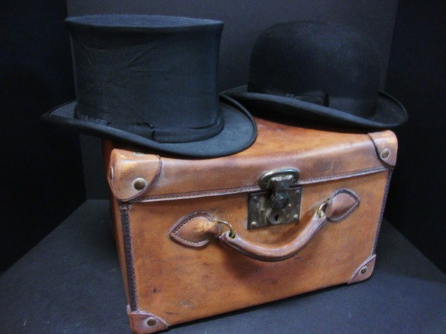Stetson Derby in original Leather Case: A Stetson derby and a top hat ( Collapsible) with a leather traveling case.