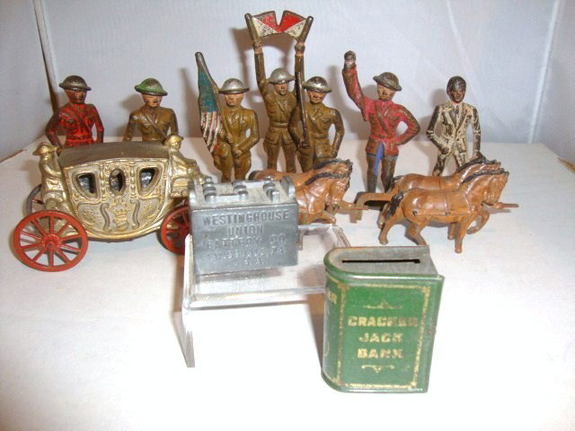 Cast Iron Soldier, Cracker Jack Bank: Cast Iron Soldiers, 7 pcs., cast iron coach & horses, cast iron battery "Westinghouse Union Battery Co, Swissvale, Pa, CI 1 1/2", tin Cracker Jack Bank 2"