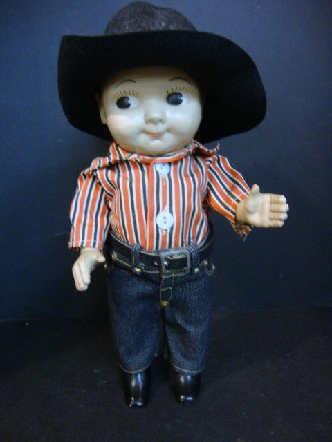 Buddy Lee Doll: Hard Plastic Buddy Lee Doll, dressed in jeans & cowboy hat that reads "Ride 'em in Lee Rider cowboy pants" 13"