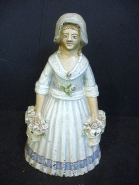 Hubley Doorstop: Flower Lady Hubley Doorstop in good original condition, beautiful muted colors, 8" (t)