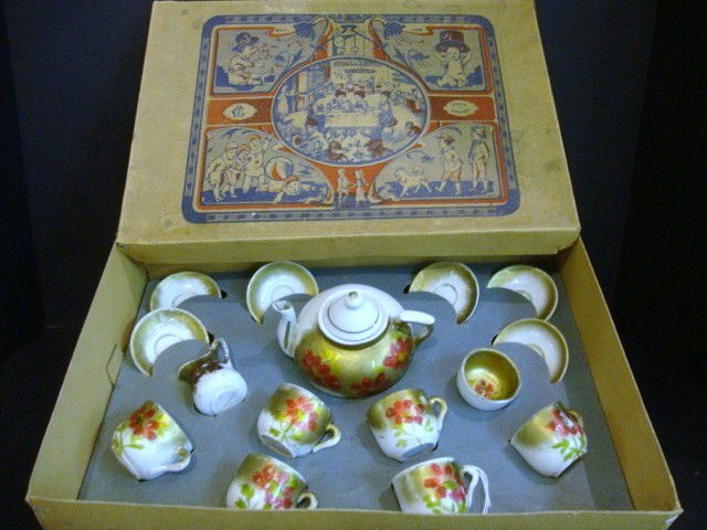 Doll Dishes: German Tea Set in original box w/lithos of children, made in Germany 9 1/2" x 13", white w/red flowers, 15 pcs w/original liner in box