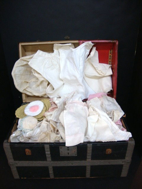 Victorian Doll Clothing in Doll Trunk: Vintage White Victorian Clothing in antique Dome top Doll Trunk. Over 30 pieces of clothing, some knitted items also.