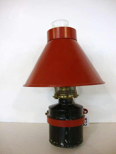 Northern Pacific Bunk Car Wall Lamp: N.P. embossed on cast iron wall mount, brass adjusting knob on cast ring holds kerosene pot intact, 9" (di), shade fits around top of chimney w/wall mount bracket