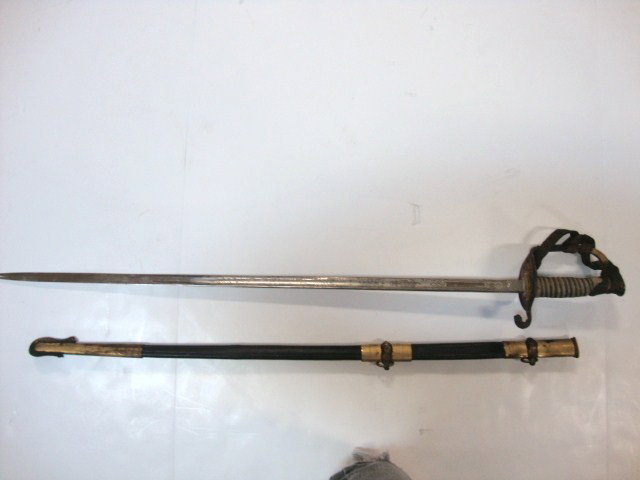 U.S. Navy Dress Sword Gold Gilt: Eagle Pommel, shagreen & wire wrapped grip, hand guard marked USN, blade 30" long marked Armstrong Chicago with frosted military insignia, scabbard has dragon shaped drag