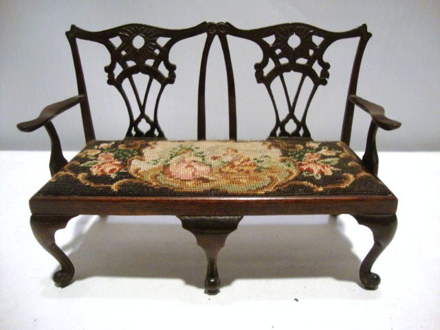 Eric Pearson Chippendale Settee: Mahogany Chippendale two-seater settee with antique petitpoint seat 4.25" L, 3" H.