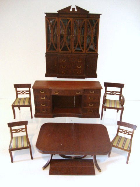 Early Lynnfield Dining room Set: A large lot comprising a mahogany breakfront bookcase with original books 6.5" H (one plastic "glass" panel loose), sideboard, Duncan Phyfe table with one leaf and good legs, four chairs in excellent