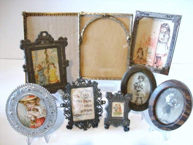 Antique and Vintage Pictures and Frames: An assortment of antique and vintage framed prints of various sizes and two full-sized decorative metal frames, the largest 6.5" H.