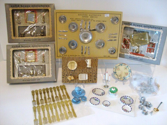 Vintage Accessories: Three boxed sets of small brass miniature accessories, Shackman dinner service sealed on original card 5.5" X 8", assorted cutlery and vintage tableware.