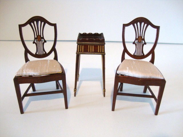 Michael Walton Inlaid Table and Tom Warner Chairs: A stunning small table by Michael Walton with satinwood inlay and banding 2.25" H, and a pair of of Hepplewhite shield-back chairs with inlaid medallions 3" H by Tom Warner.