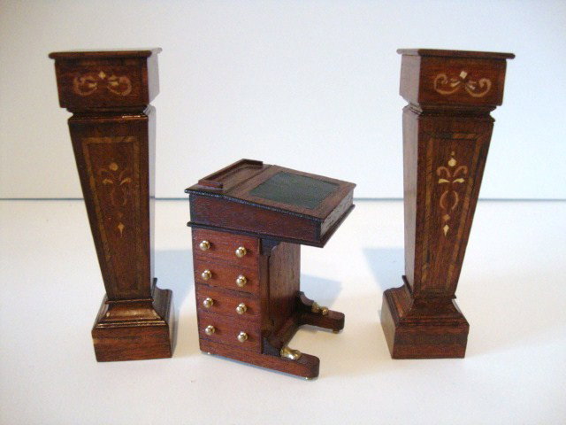 Escutcheon Davenport Desk: A mahogany Davenport or captain's desk (one drawer missing) 2.5" H and a pair of mahogany pedestals with faux marquetry designs applied to the fronts just over 4" H.