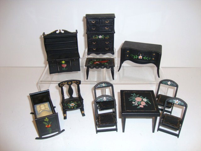 Renwal Dollhouse Furniture: Black floral Renwal furniture, 11 pieces including a crib, rocking chair, bird painted coffee table, hutch, sideboard, folding table and four chairs, in mint condition.