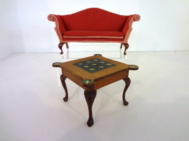 Mell Prescott Game Table and Settee: Mell Prescott game table 3.5 W and 3.5" H with leather topand gold fleur-de-lis designs on top and each end, pad foot with paper label underneath. Also a handsome Chippendale settee by the samme maker