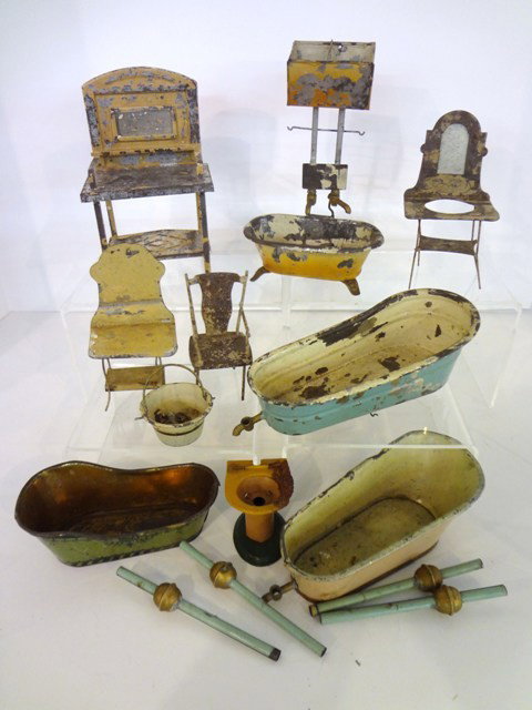 German Tin Lithographed Bathroom Items: Grouping of nine tin litho bathroom pieces: four tubs, one with water tank,three washstands, one chair 7" tallest