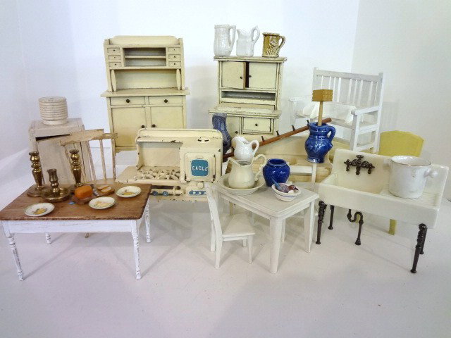 Vintage Kitchen Furniture: An assortment of vintage painted kitchen furniture including a cast iron Eagle stove 4.25" H, two kitchen cupboards, Strombecker sink, refrigerator, table and chair, rare Lynnfield table and chairs, G