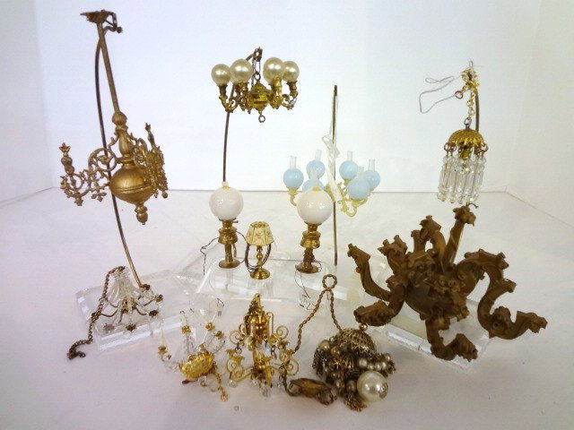 A Dozen Light Fixtures: Assortment of antique and contemporary chandeliers and lamps including a large Spielwaren chandelier 4" H, 5" W (one chip), Babette Schweizer three-arm chandelier 5" H. Nine chandeliers and three tabl