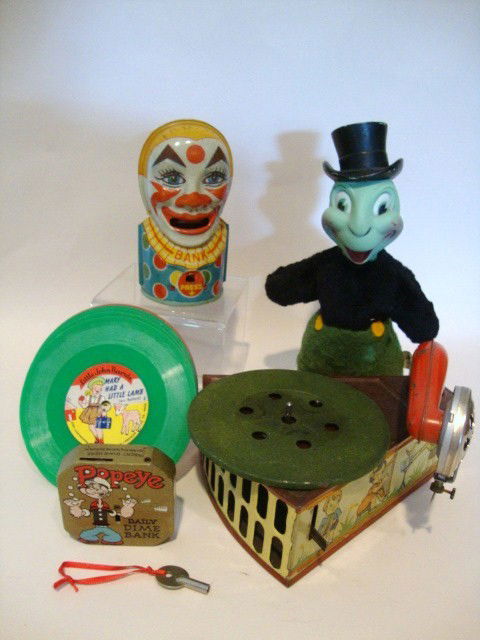 Vintage Toy and Record Player Lot: Vintage Tin Litho "Niftyola" Record Player, 7" (l) w/6 records, made in Germany, 1956 Tin Popeye dime bank, Gundikins Jiminy Cricket stuffed doll, 1950's, 10" (t), clown dim bank by Chein, 1950's 5" (