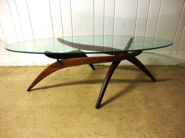 Modern Coffee Table: Modern Coffee Table with Glass top and folding Base. very streamlined look. 15 x 53 x 19"