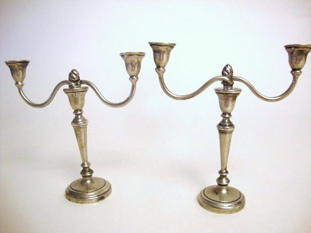 Meyers George III Pair Candleabra: Meyers George III pair of candelabra, with flame center and round base 3" H, marked M Sterling, hand made