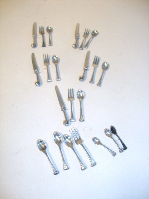 Meyers Grouping of Pistol Handle Flatwear: Grouping of pistol handle flatware after silversmith Isabel Pero 1750. Twenty-two pieces, 1.50 to 1.75", unmarked This is an important set as it was part of the Loan Exhibition of Miniature Furniture 