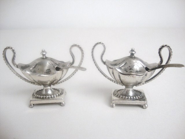 Meyers Pair George III Soup Tureens: Pair of George III Neo-classical oval soup tureens after Timothy Renou, London 1802, with beaded loop handles and beaded square base on four ball feet. Removable top with finial and cut for ladles. Ve